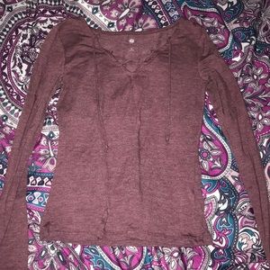 burgundy long sleeve with crisscrossing on chest